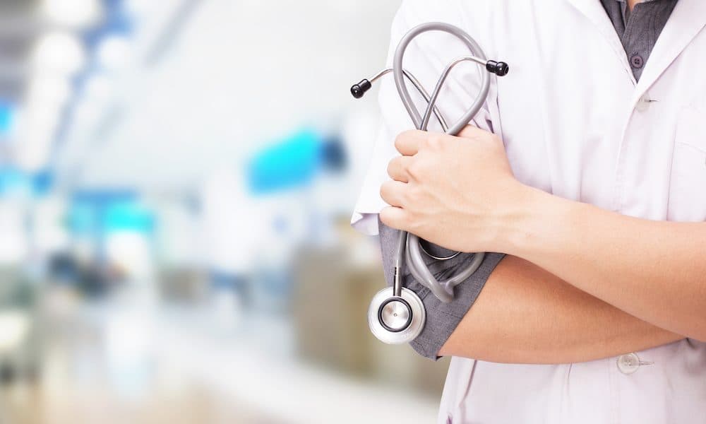 Doctor with a stethoscope in the hands and hospital background Hospital launches gynaecological diagnostics service