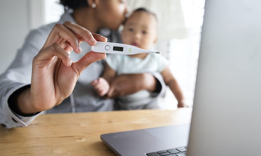 African American mom showing baby’s fever to doctor through telemedicine call Five healthcare trends for 2021 forged in the turmoil of 2020