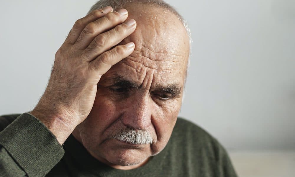 Forgetful senior man holding a hand to his head The US$44m shot at preventing dementia through tech
