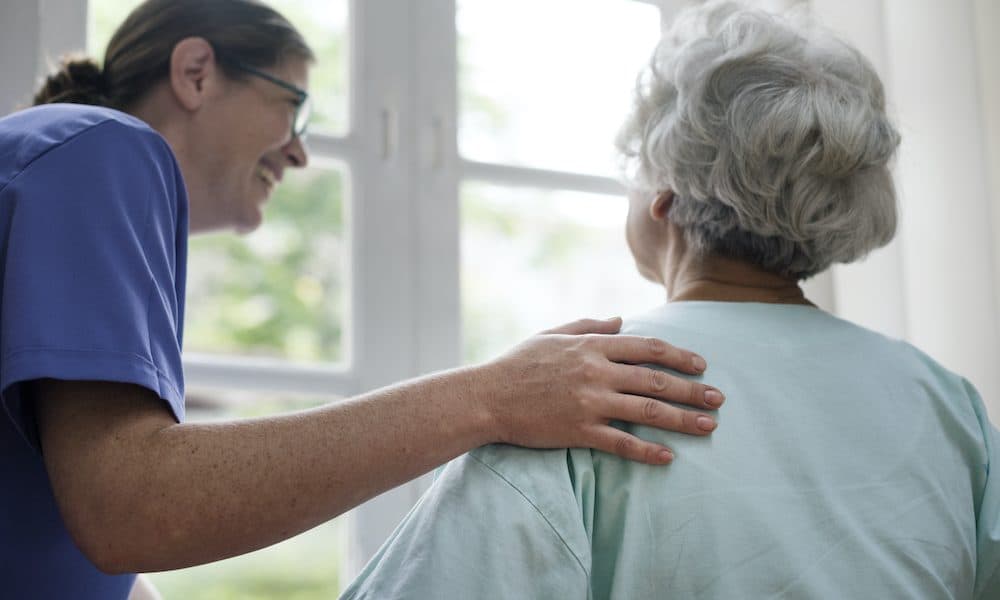 Nurse taking care of an old woman Mobile health improves outcomes for seniors – report