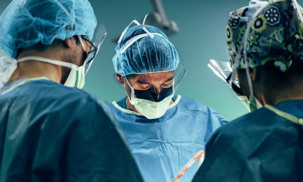 Team of Surgeons Operating. Hospital adopts new tech in colorectal service