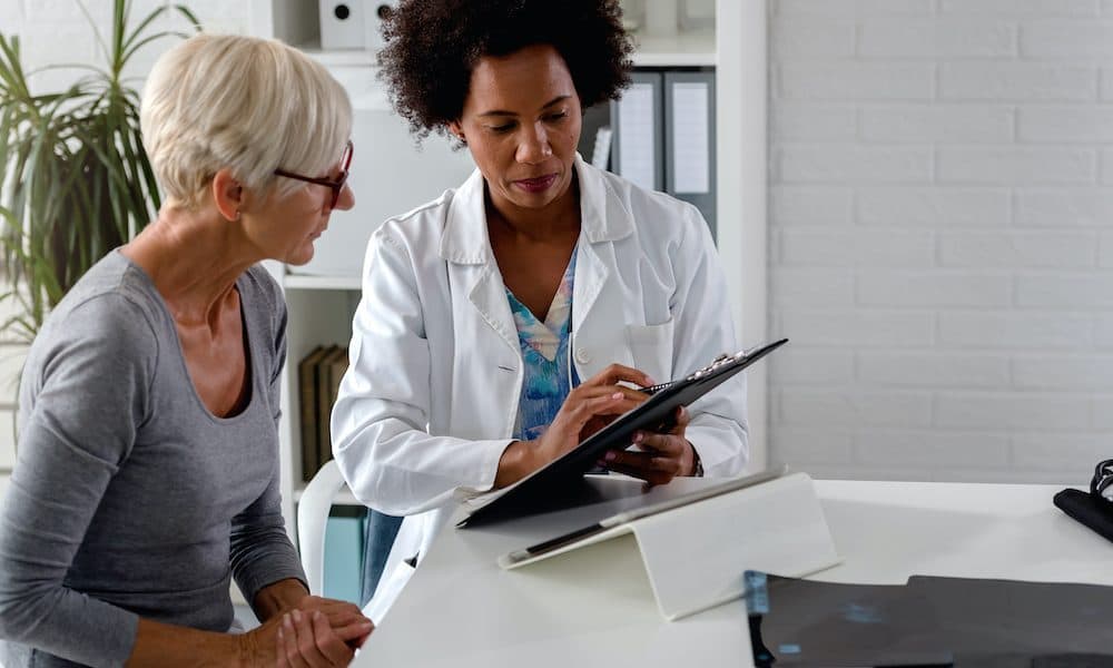 A,Female,Doctor,Sits,At,Her,Desk,And,Chats,To Personalised medication platform backed by $6m funding