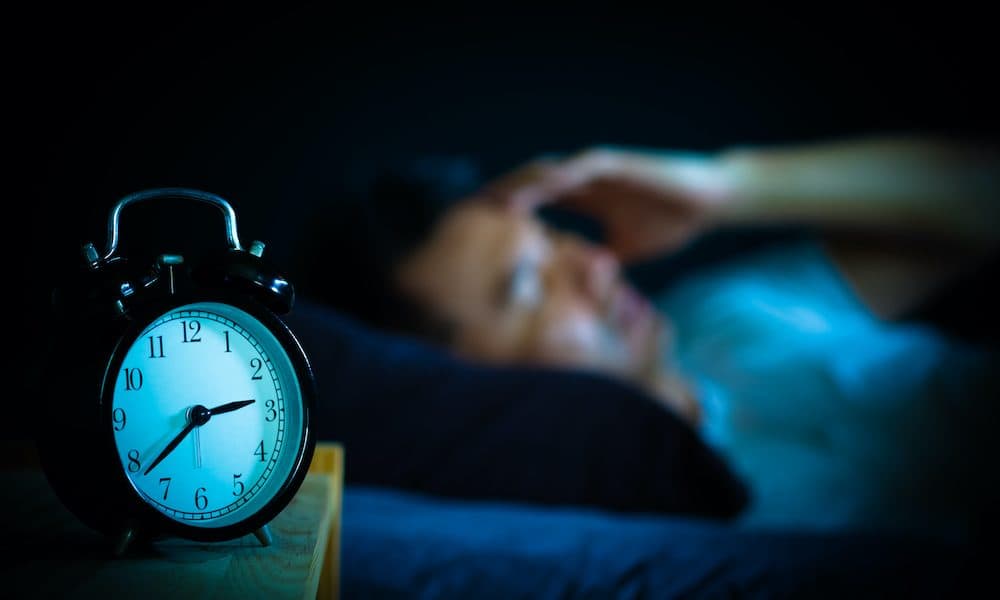 Asian,Man,In,Bed,Suffering,Insomnia,And,Sleep,Disorder,Thinking One hour’s screen use after going to bed increases insomnia risk by 59%, study finds