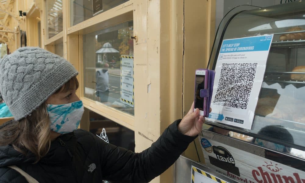 Dartmouth,devon/uk-october,27,2020:,A,Lady,With,Face,Mask,Uses,Her,Smart Tracking the way to a smarter healthcare industry