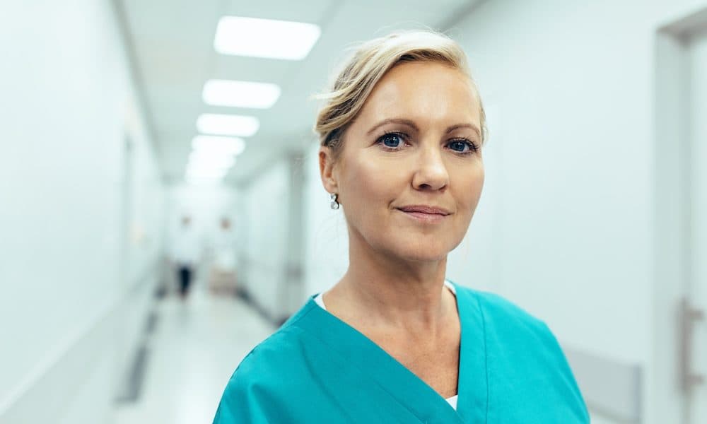 Close,Up,Portrait,Of,Female,Healthcare,Worker,Standing,In,Hospital Gemserv protects Liverpool Women’s network