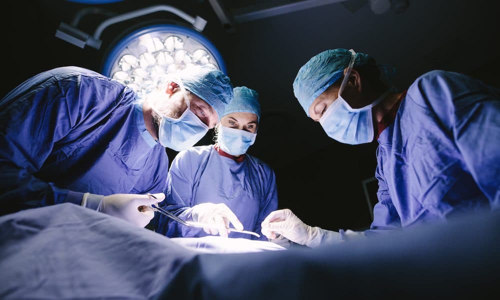 Group of surgeons doing surgery in hospital Health tech key to curbing post-surgical fatalities – report
