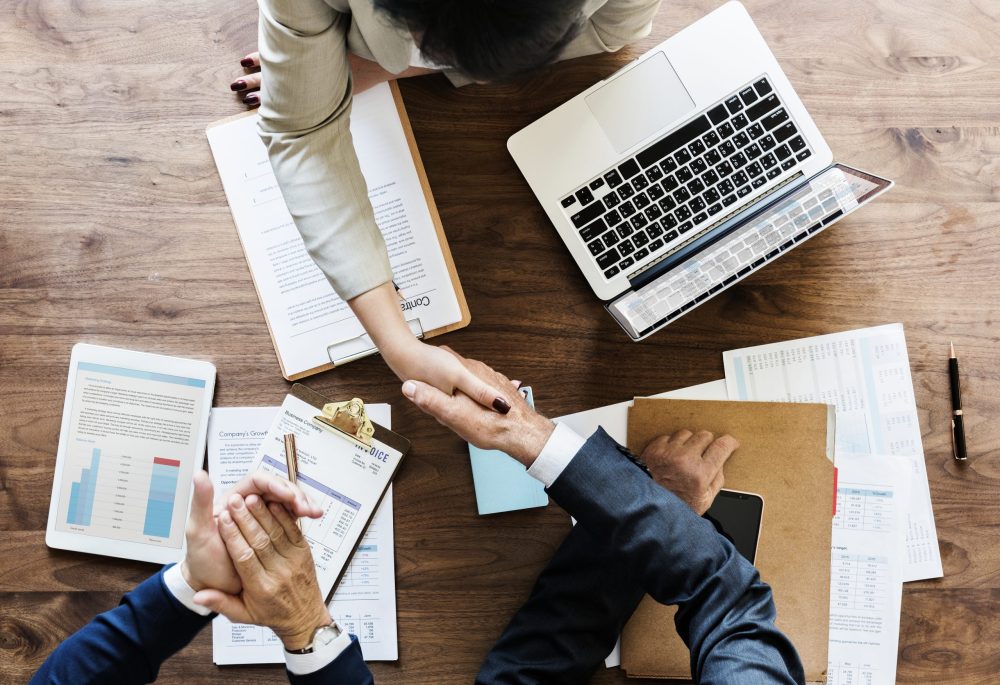 Business people shaking hands together US telehealth platform Hims acquires European rival Zava for undisclosed sum in international expansion push
