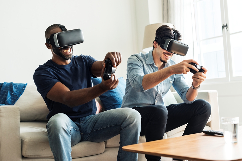 Men experiencing virtual reality with VR headset From Gameplay to Well-being – Positive Effects Gaming Can Have on Our Well-being