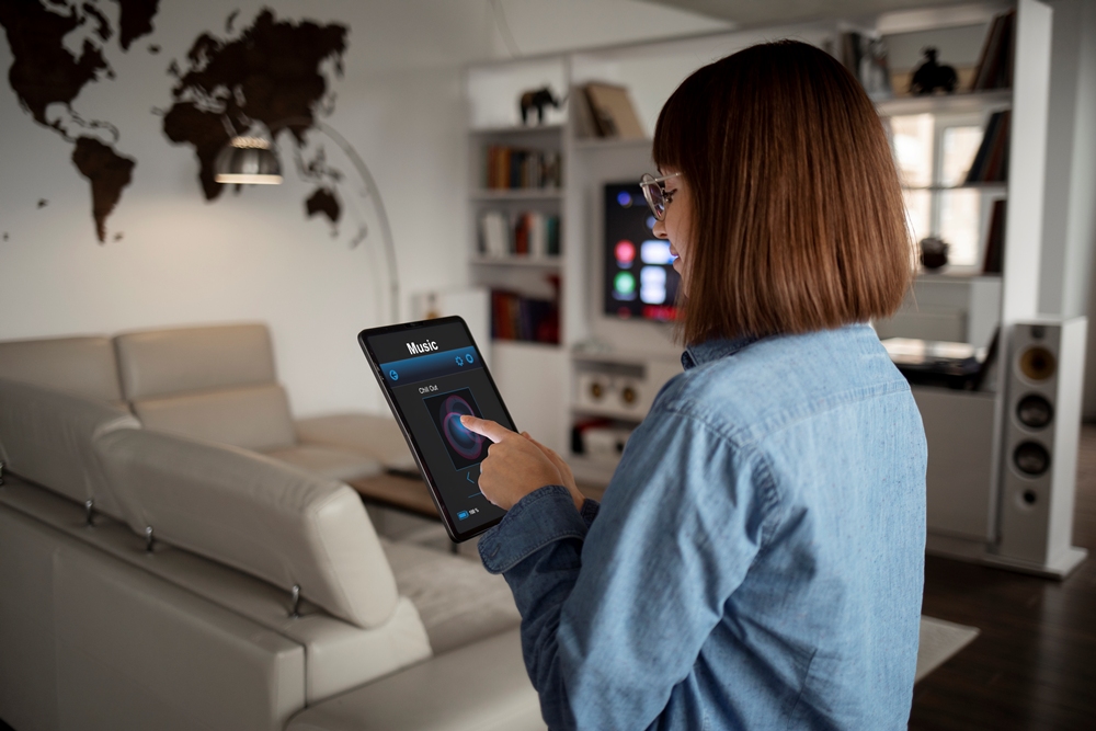 young-woman-using-home-technology Smart housing is the missing link in public health