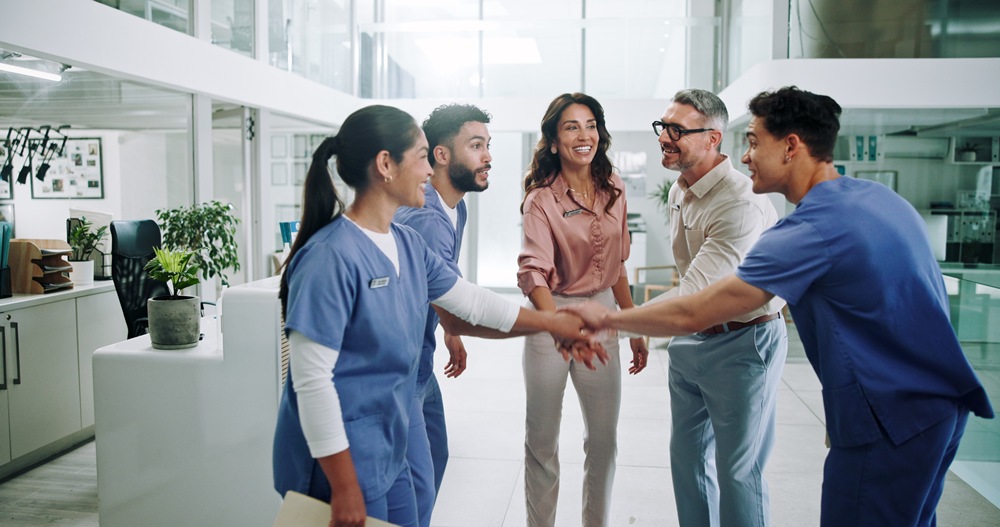 happy-people-doctor-team-with-hand-stack-motivation-collaboration-unity-hospital-group-nurses-healthcare-employees-piling-solidarity-with-smile-meeting-mission-clinic UK, Singapore launch regulatory innovation corridor